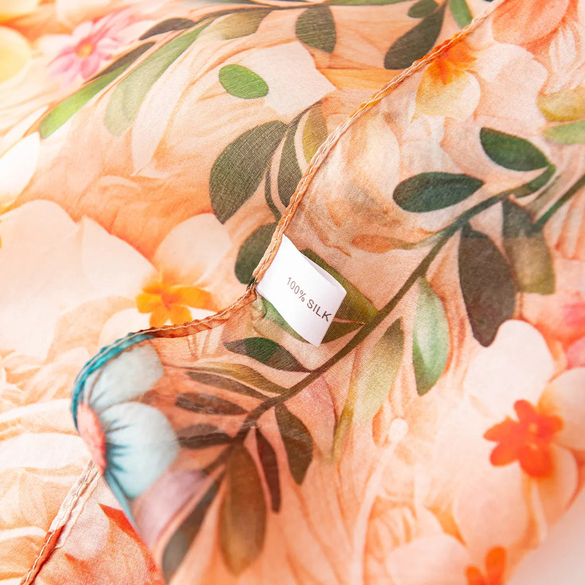 100% silk label on apricot floral scarf