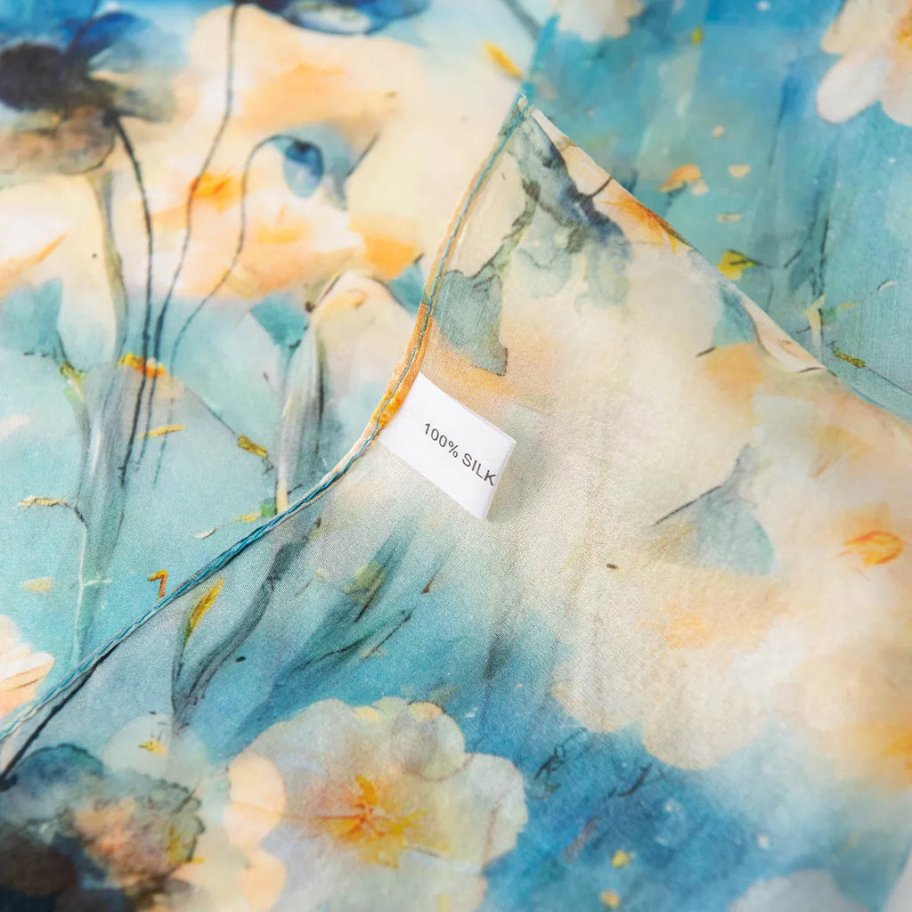 100% silk label on aqua floral scarf