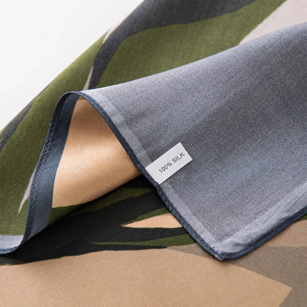 100% silk label on blue-bordered floral silk scarf