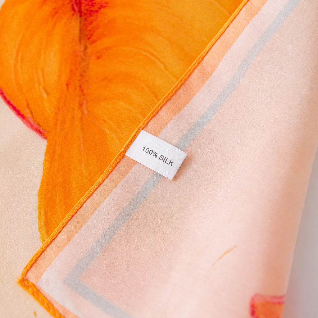 100% silk label on peach orange silk scarf