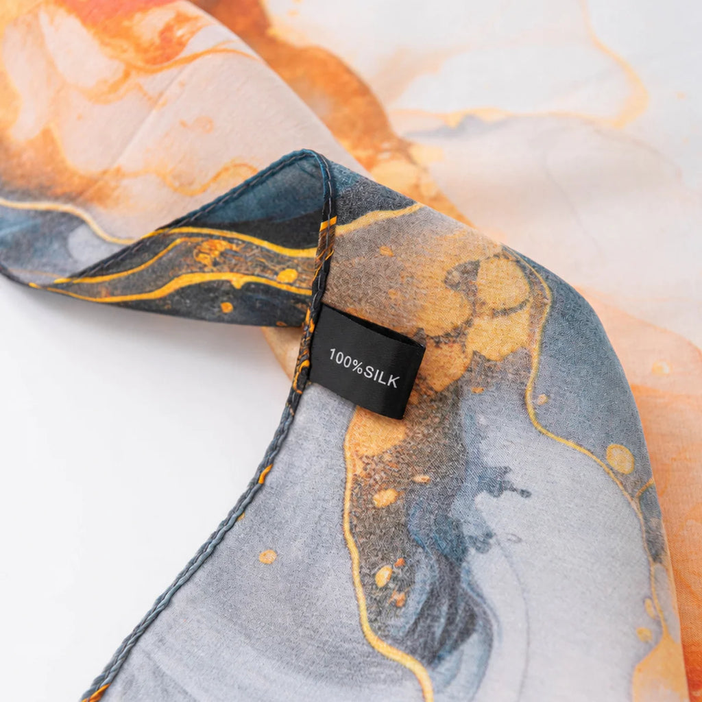 Abstract marbled silk scarf label detail
