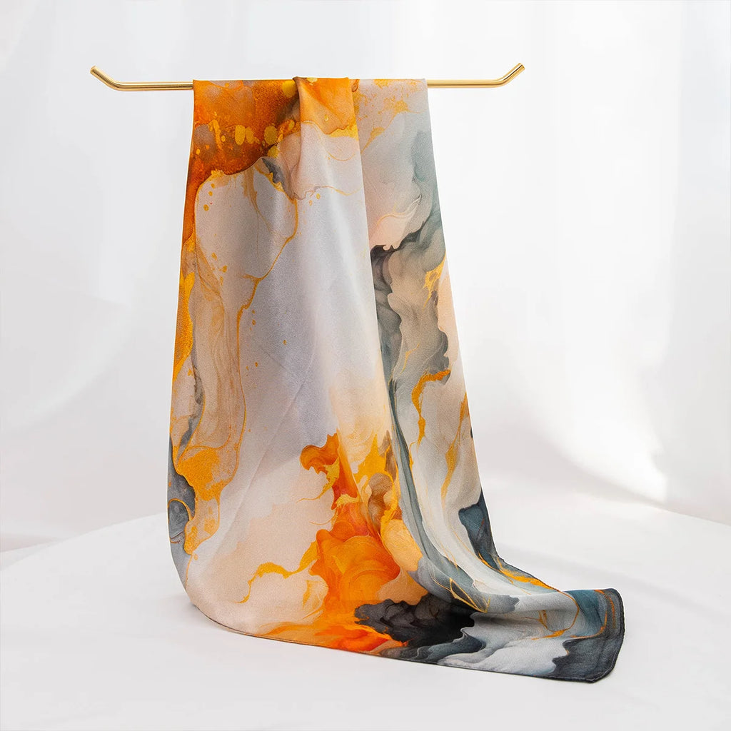 Abstract silk scarf draped over hanger