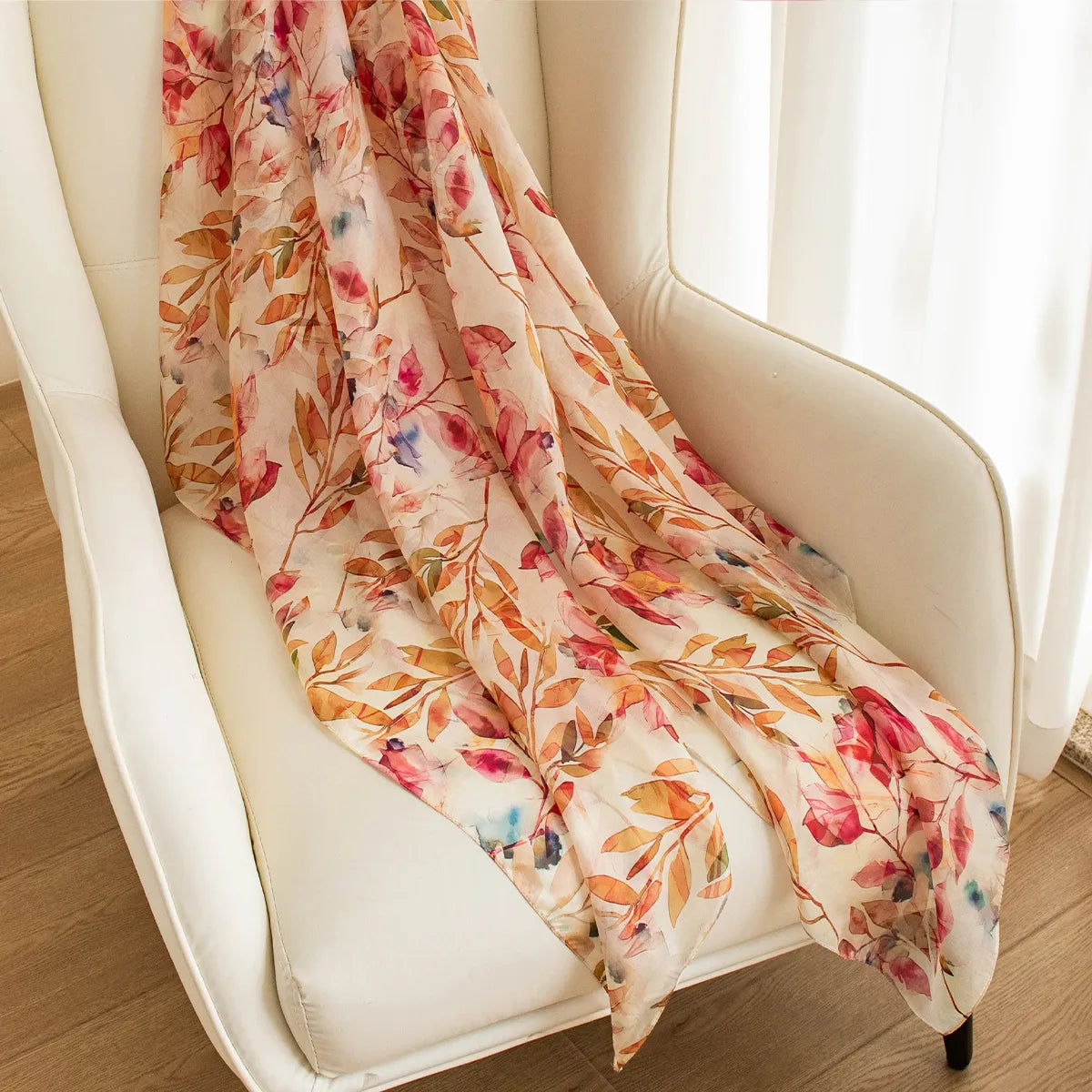 Amber falling leaves silk scarf on chair