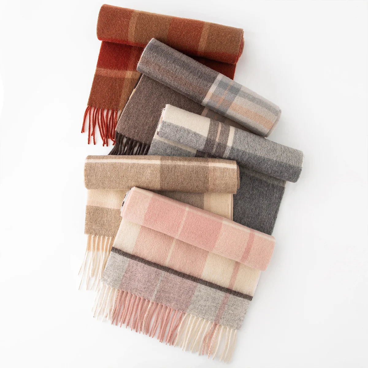 Assorted plaid wool scarves arranged in a vertical folded display