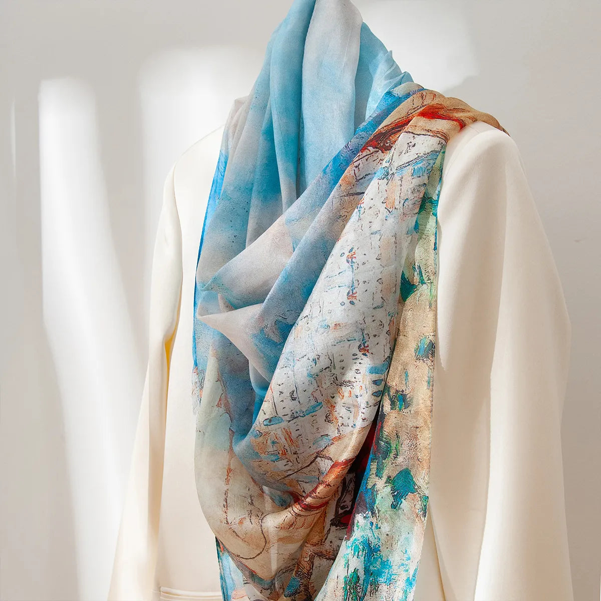 Azure sailboat silk shawl draped on blouse