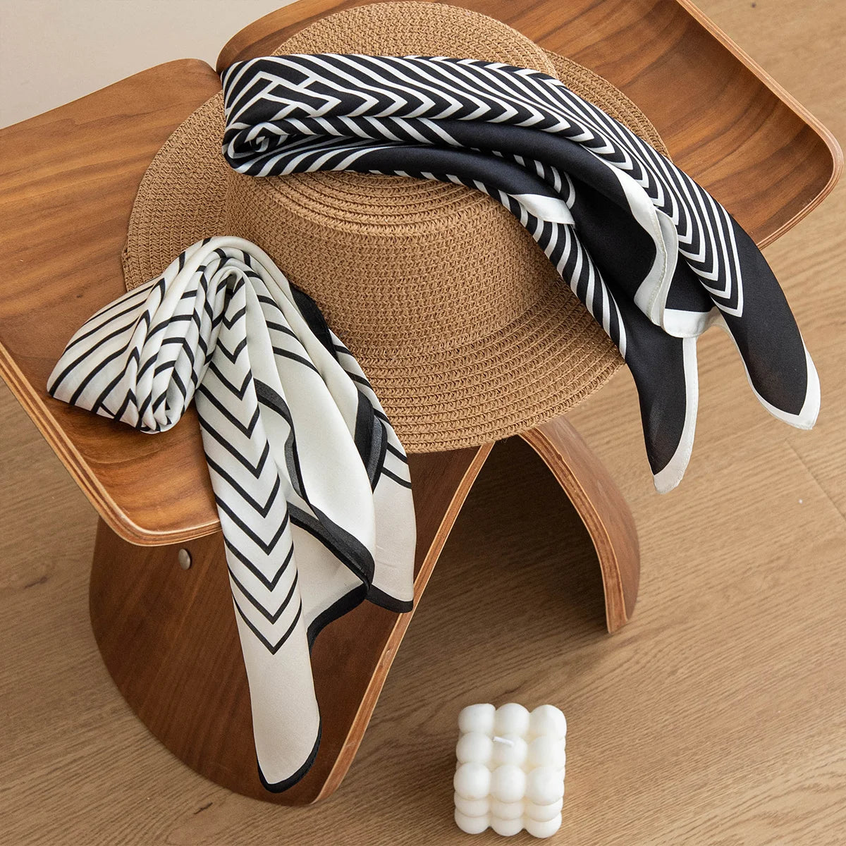 Black and white concentric line scarves styled on hat