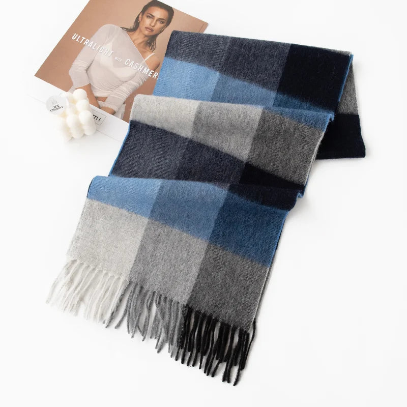 Blue and gray block check scarf folded beside photograph