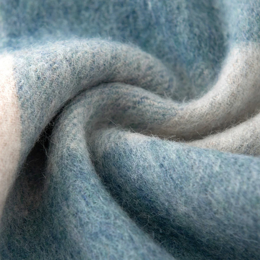 Blue cream buffalo check fabric gathered into a swirl