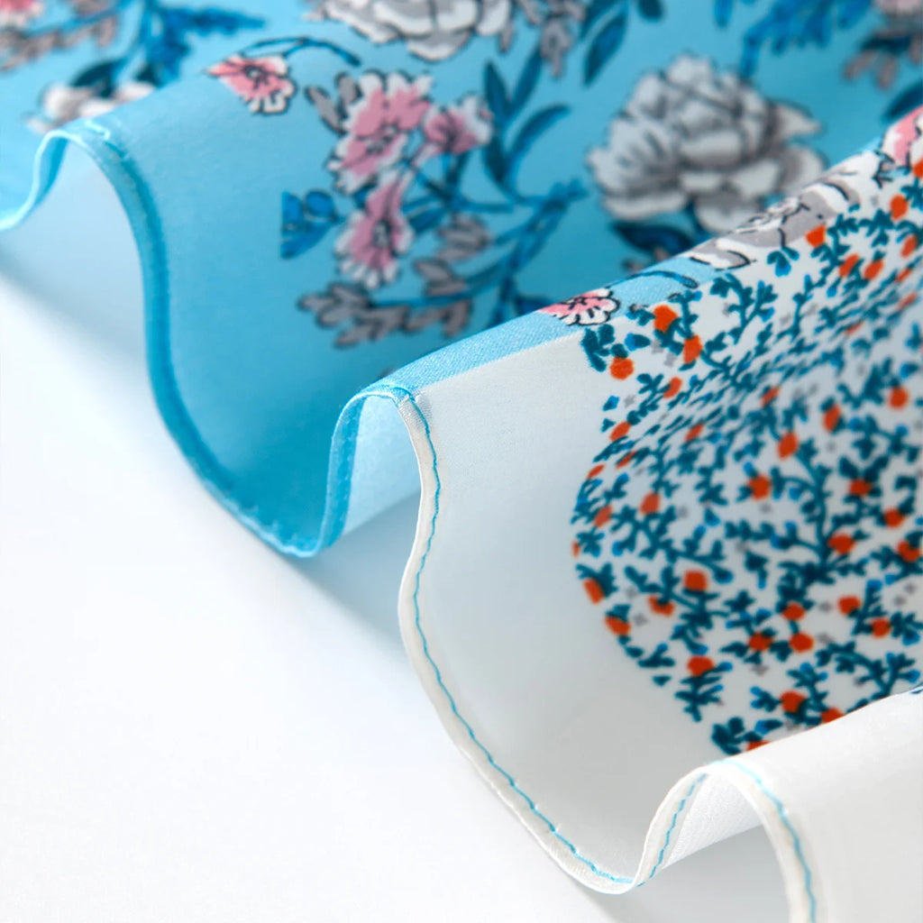 Blue floral silk scarf rolled edge detail