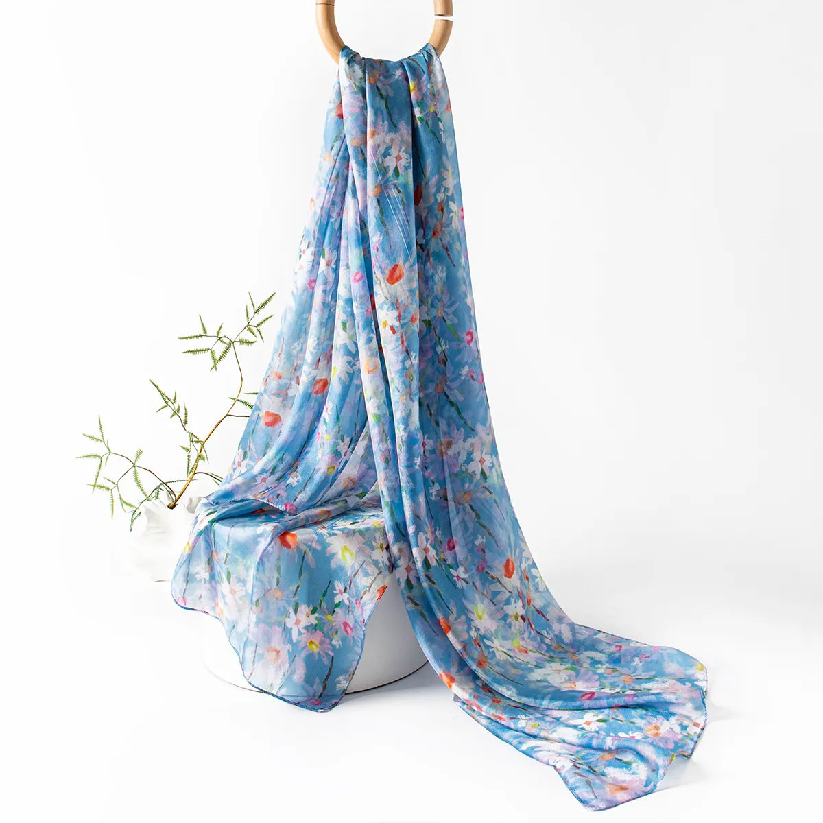 Blue wildflower silk scarf hanging display
