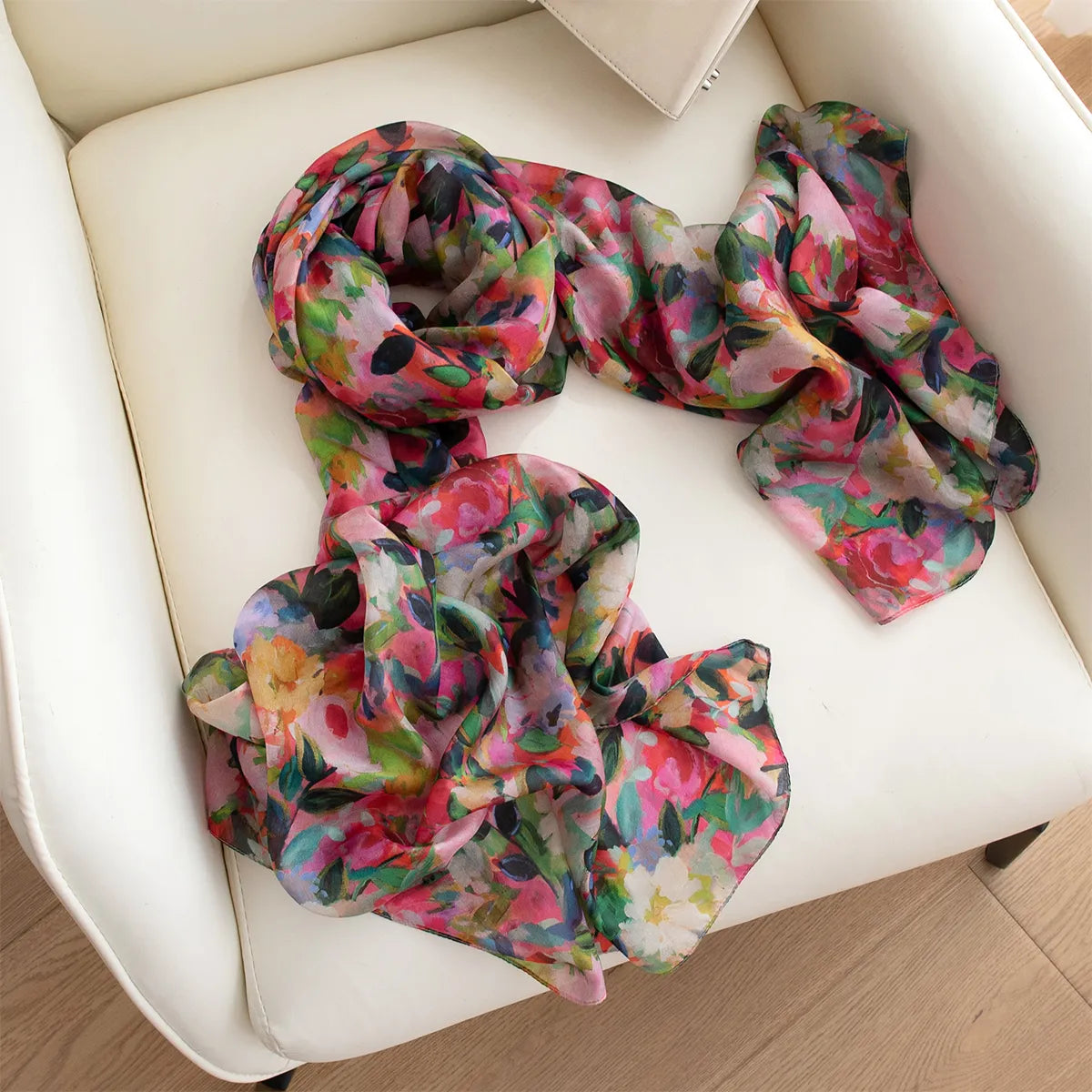 Blush daisy silk scarf on chair