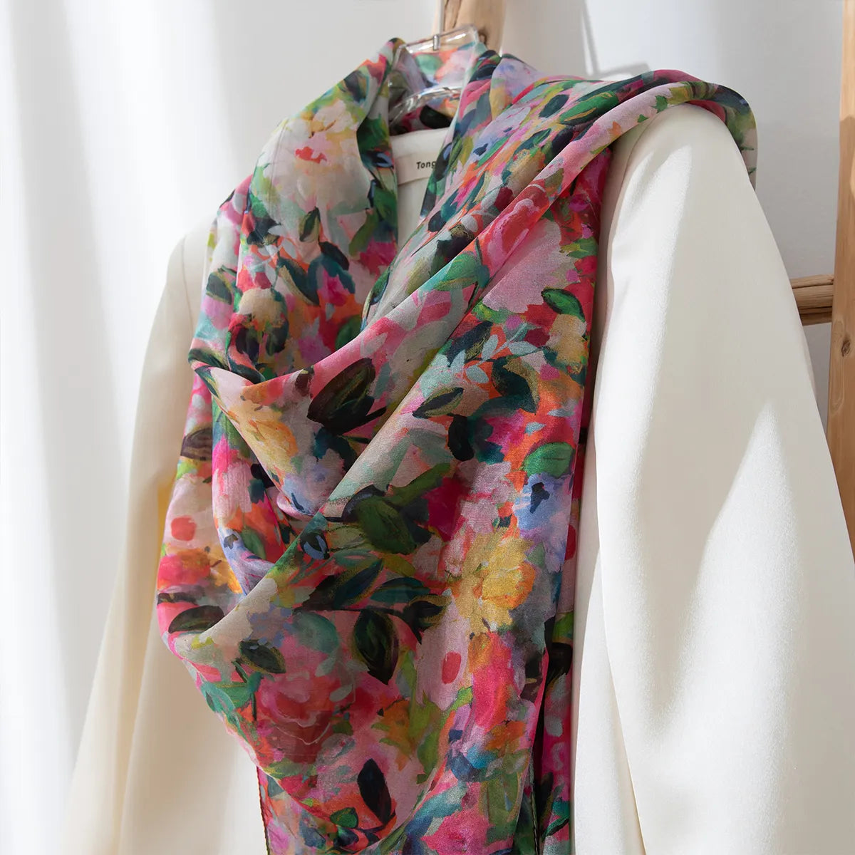 Blush daisy silk shawl on white blouse