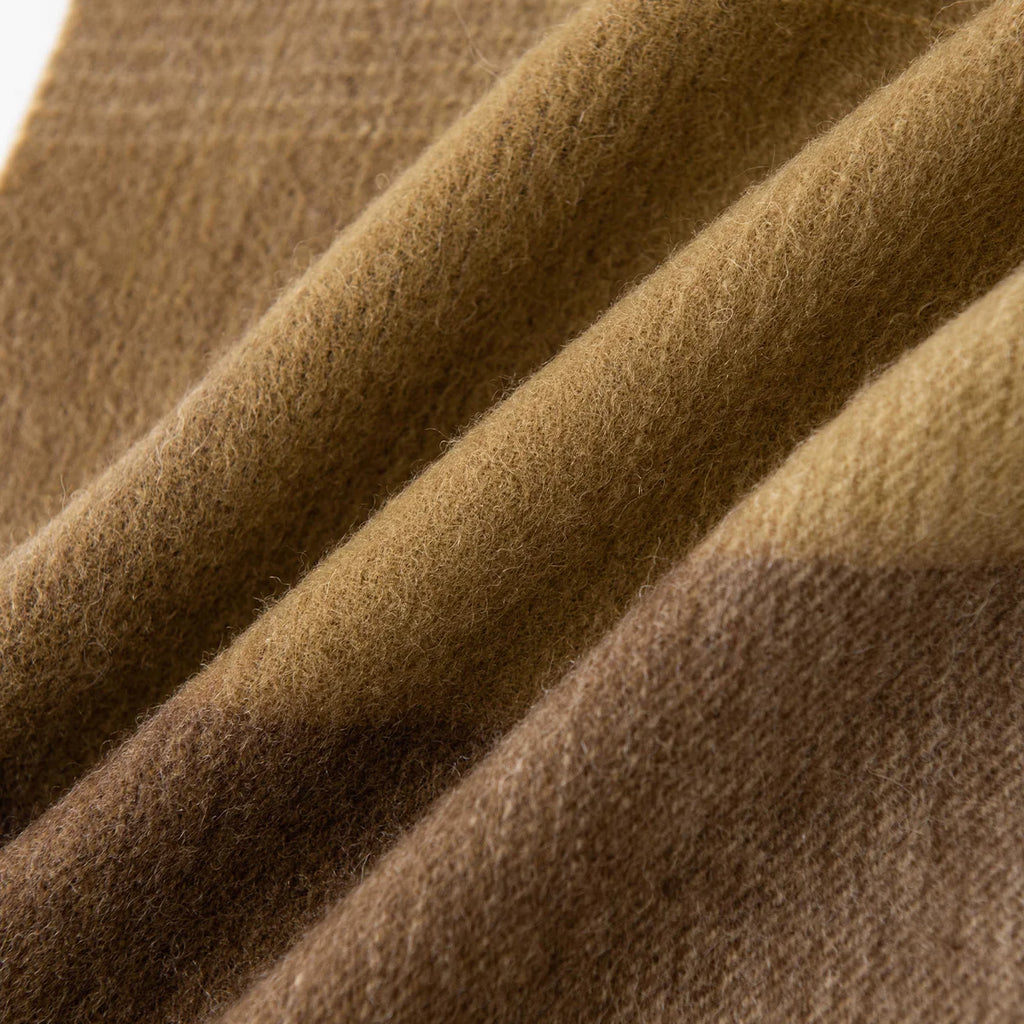 Broad mustard brown blocks visible across softly brushed folds