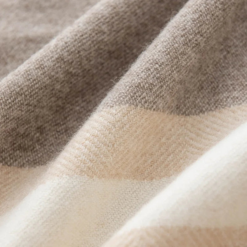 Broad neutral check bands crossing gently folded cashmere fabric