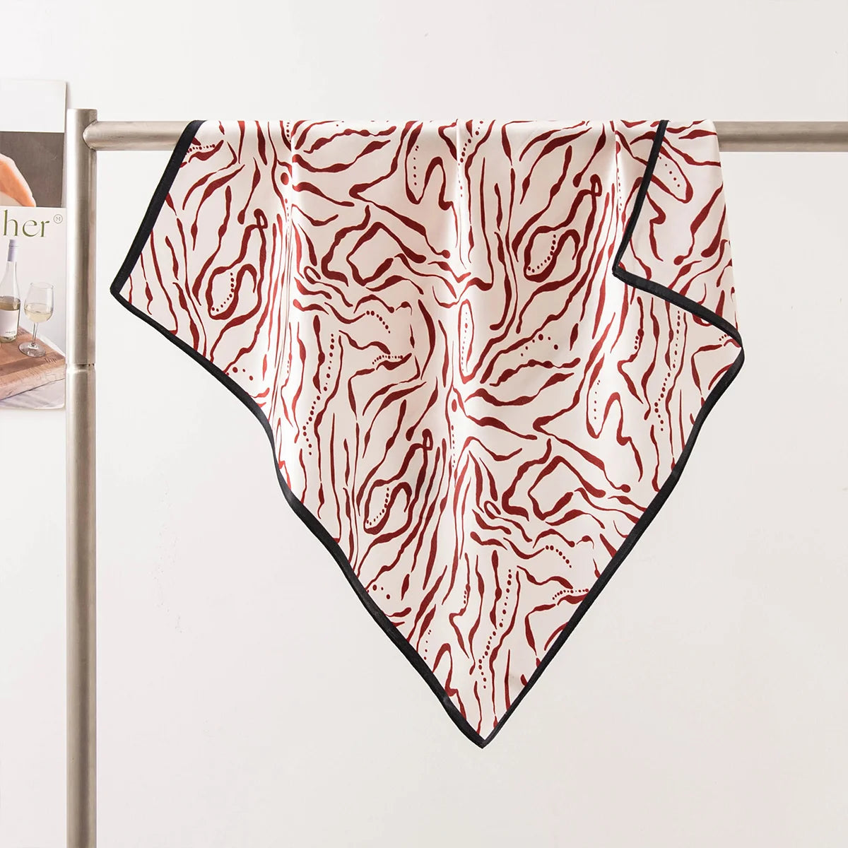 Burgundy line Silk Square Scarf draped tabletop display