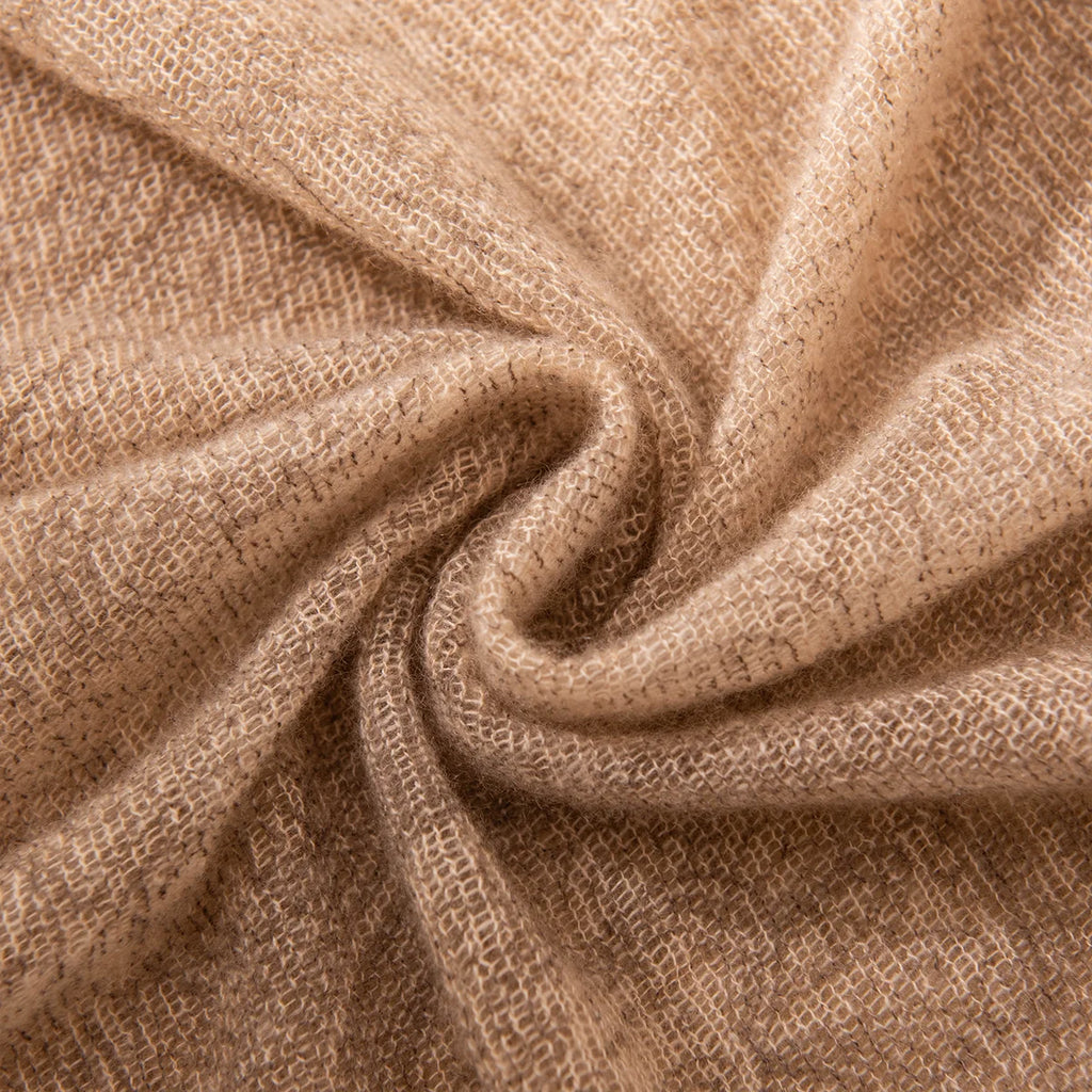 Camel open weave fabric gathered into a central swirl