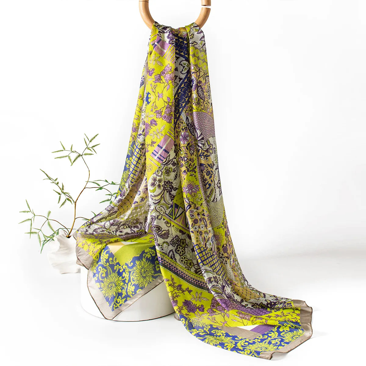Citron paisley silk scarf hanging display