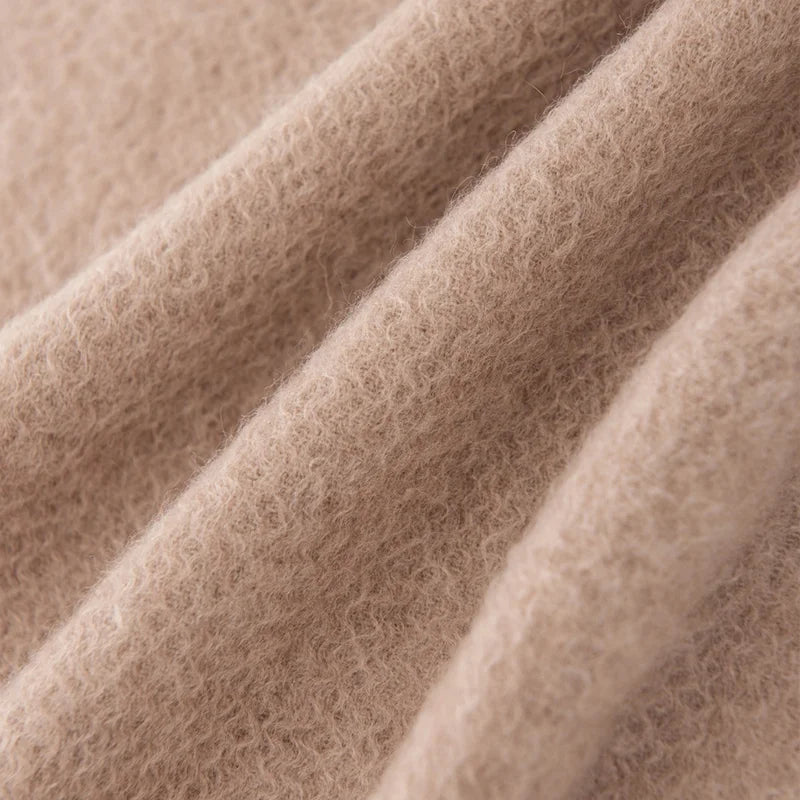 Close view of plain taupe fabric in gentle folds