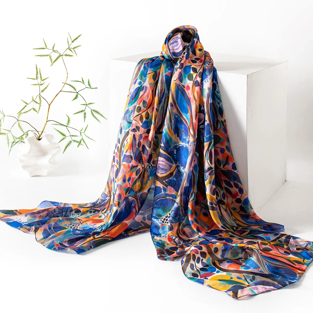 Cobalt and tangerine silk scarf hanging display