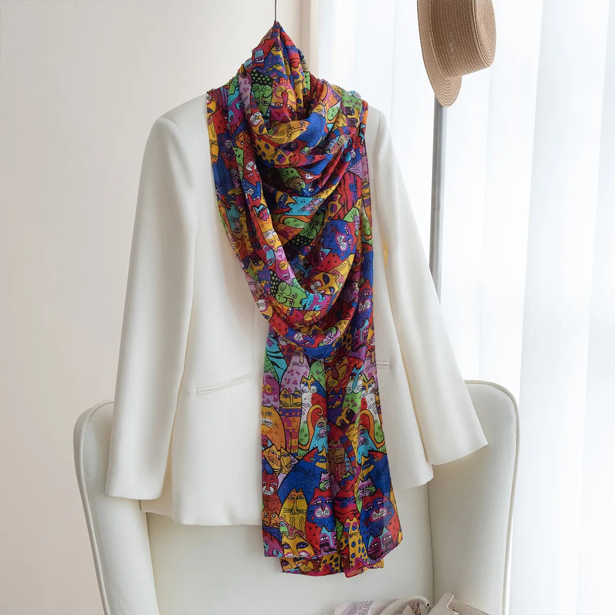 Colorful silk scarf over a cream blouse