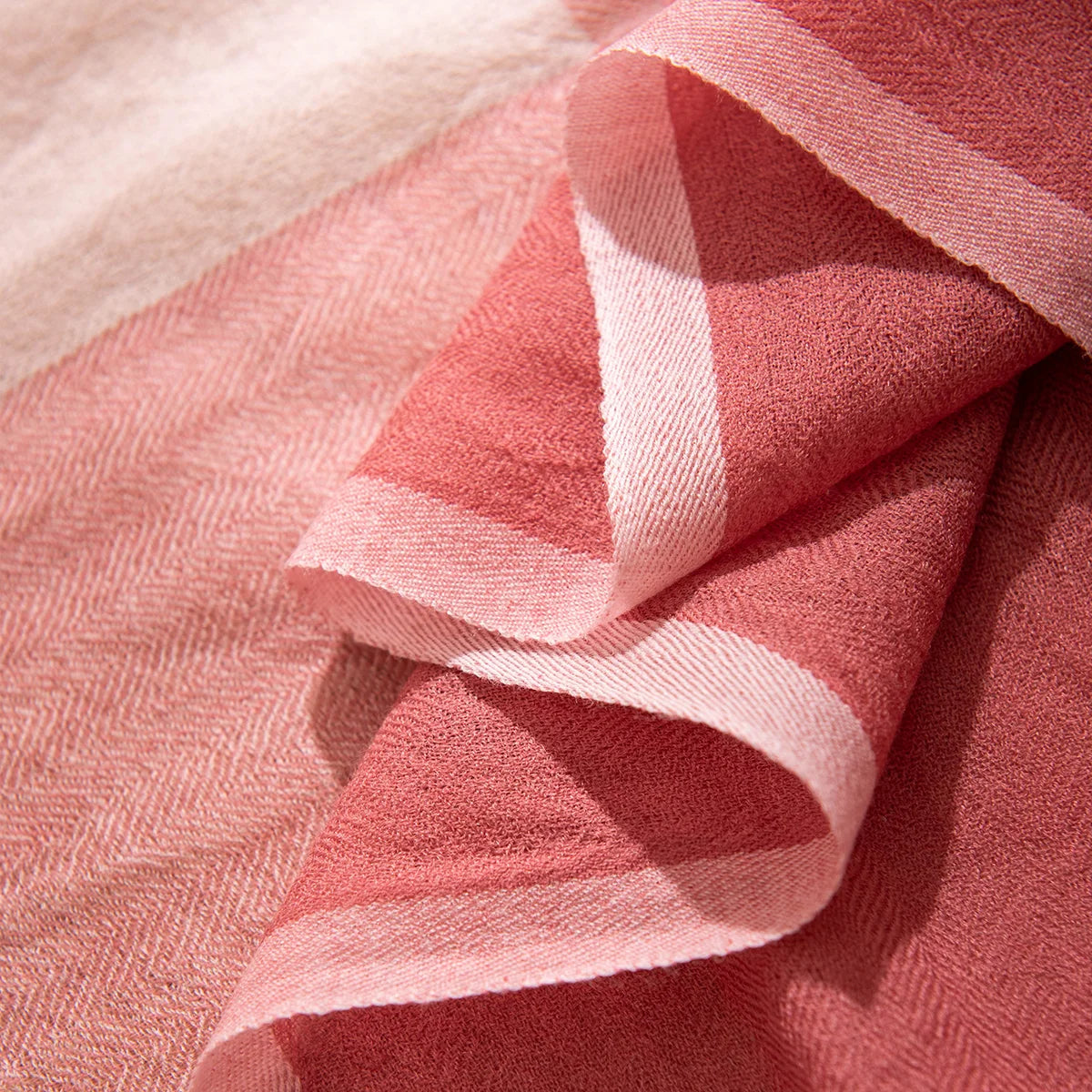 Curled rose and pale pink panels showing contrasting borders