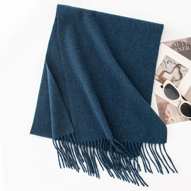 Deep teal fringed scarf on clean white background
