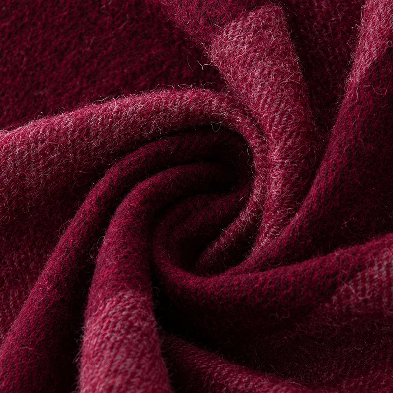 Deep burgundy fabric gathered into a central swirl