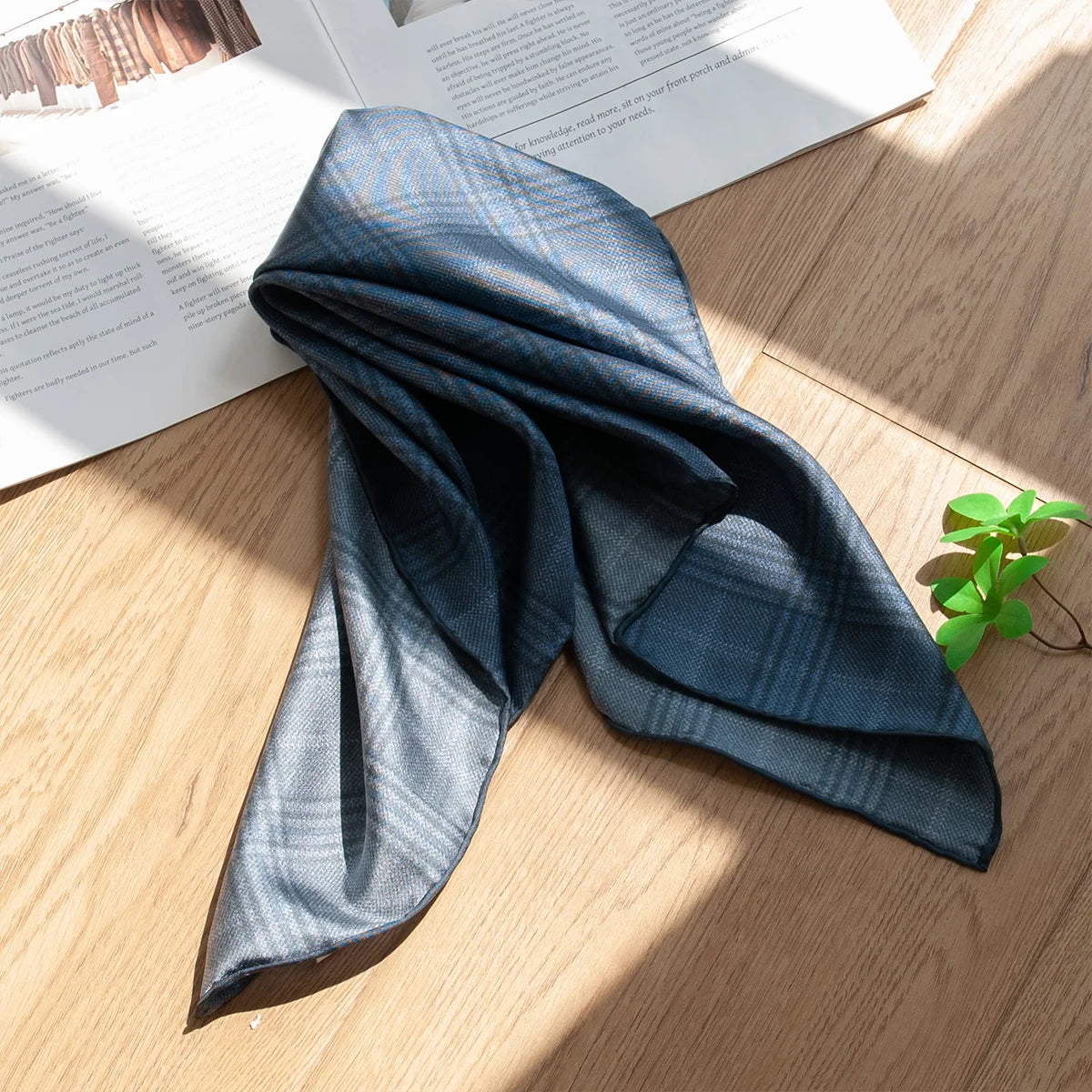 Draped blue plaid Silk Square Scarf on tabletop