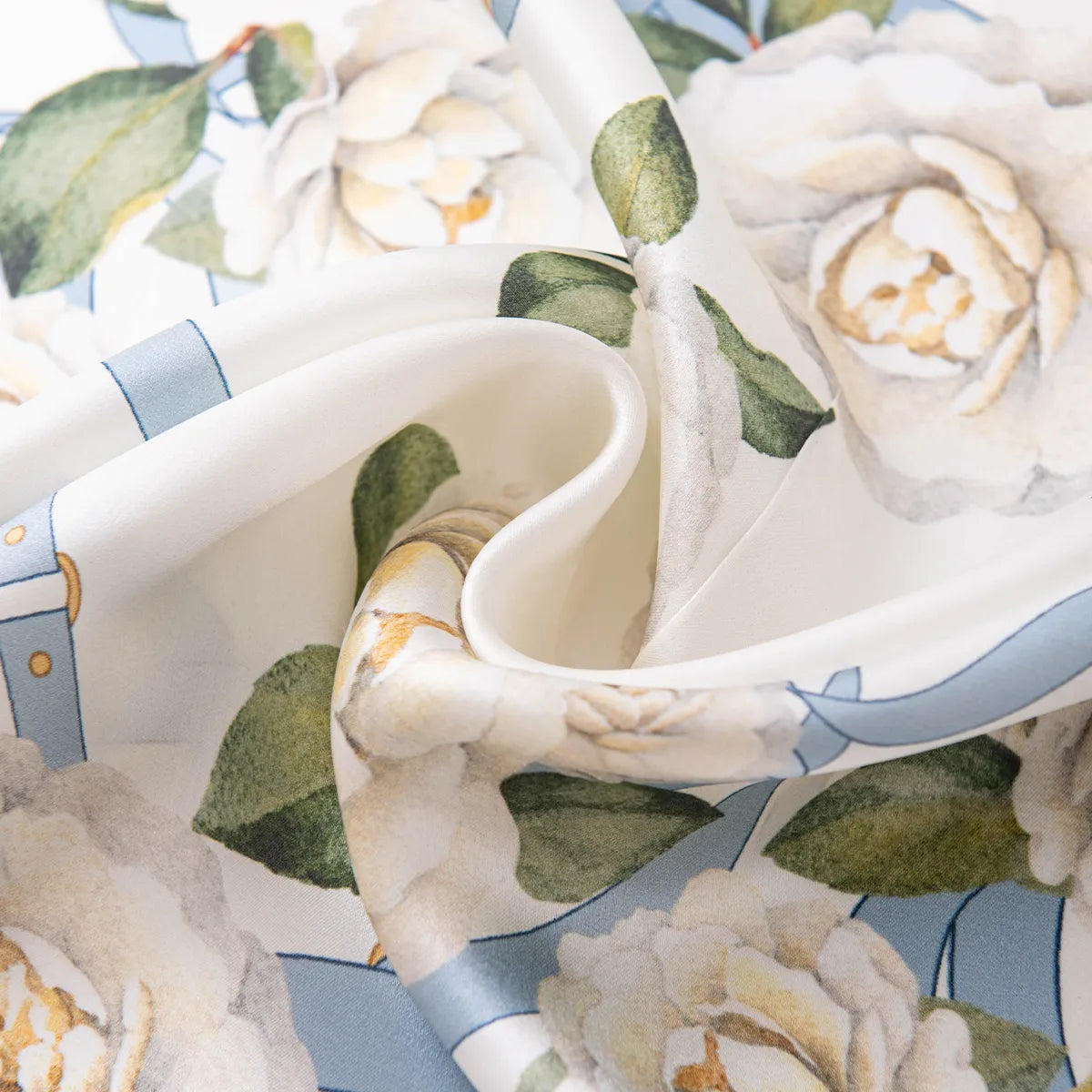 Draped white silk scarf with blue strap and floral motif