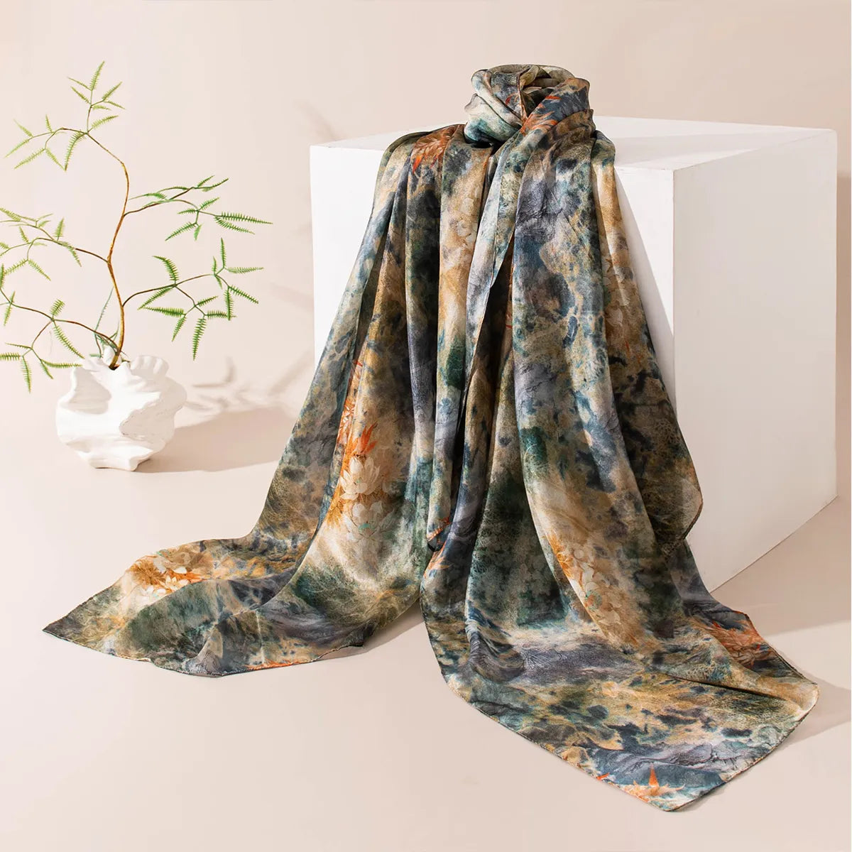 Emerald botanical silk scarf on display stand