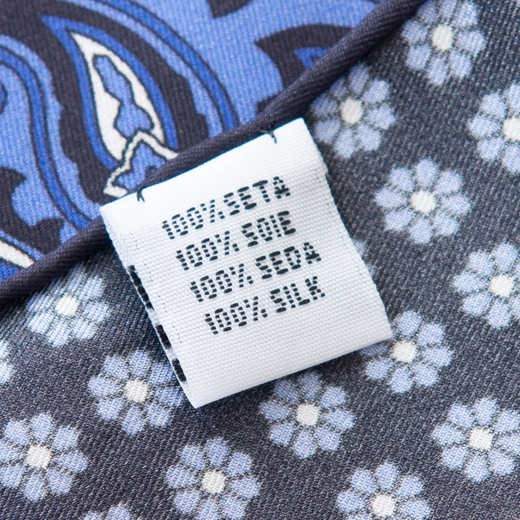 Fabric label detail of blue paisley Silk Square Scarf