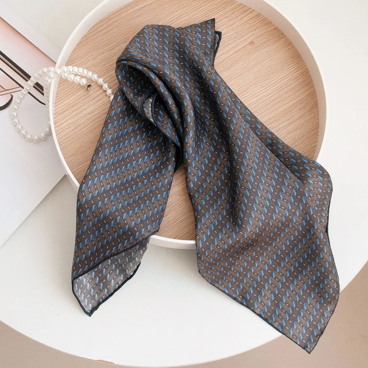 Folded blue stripe Silk Square Scarf tabletop display