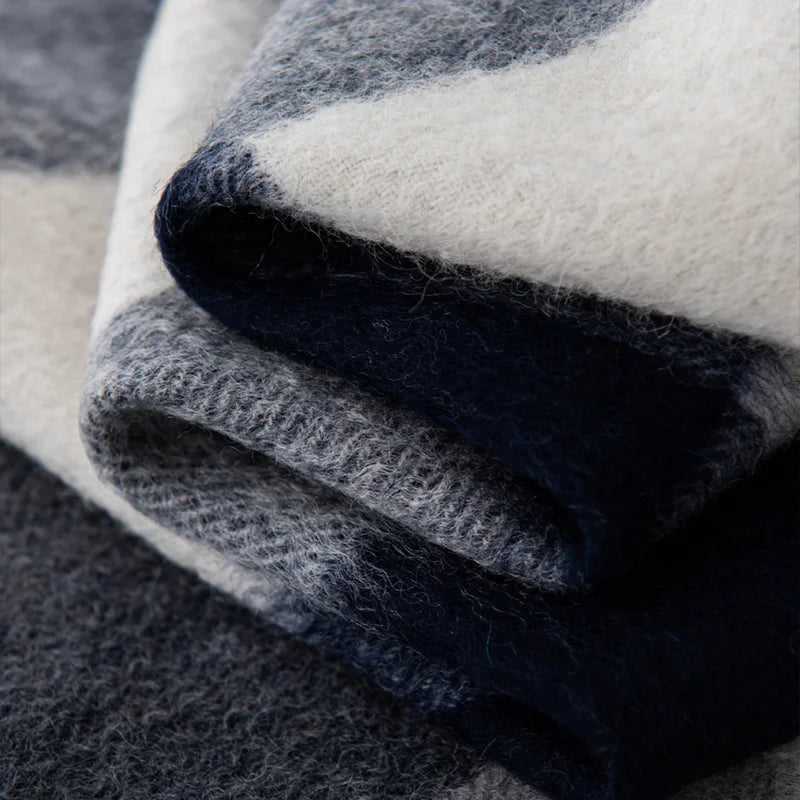 Folded charcoal gray and cream layers with fuzzy edges