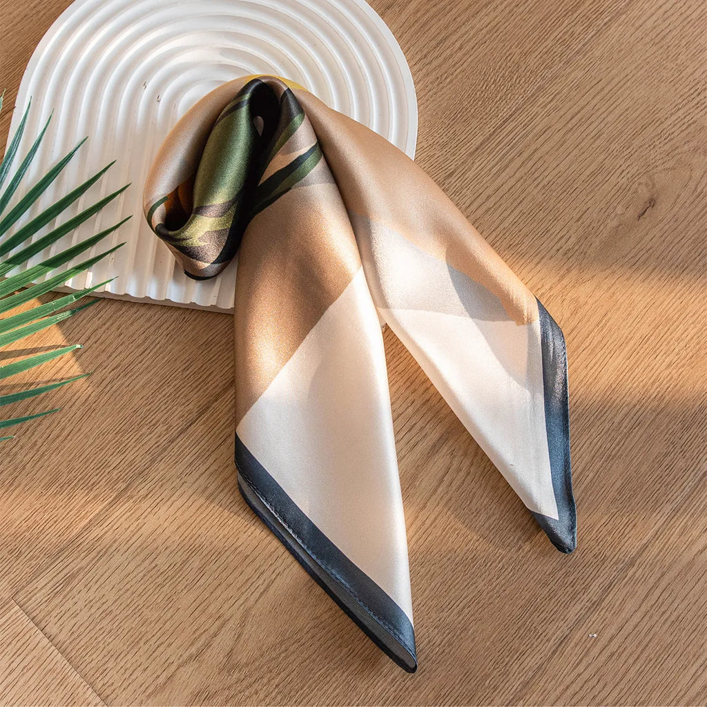 Folded cream and beige silk scarf with dark border