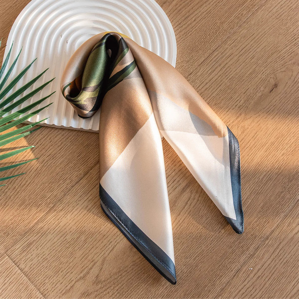 Folded cream and beige silk scarf with dark border