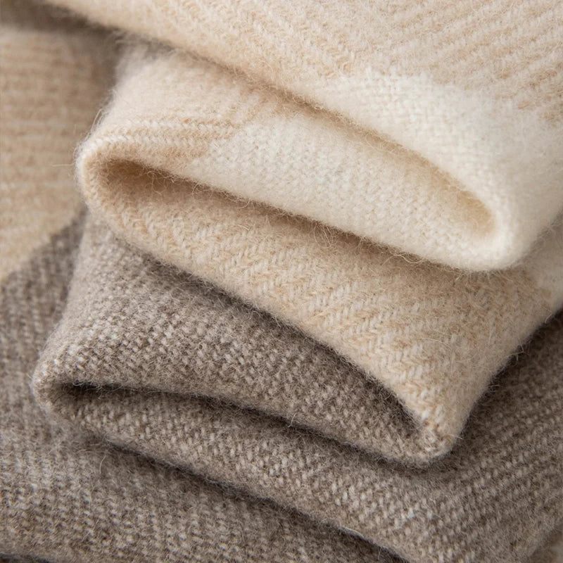 Folded neutral checked layers revealing the soft woven texture