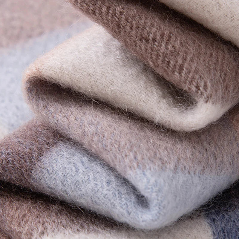 Folded pastel checked cashmere layers showing fine woven texture