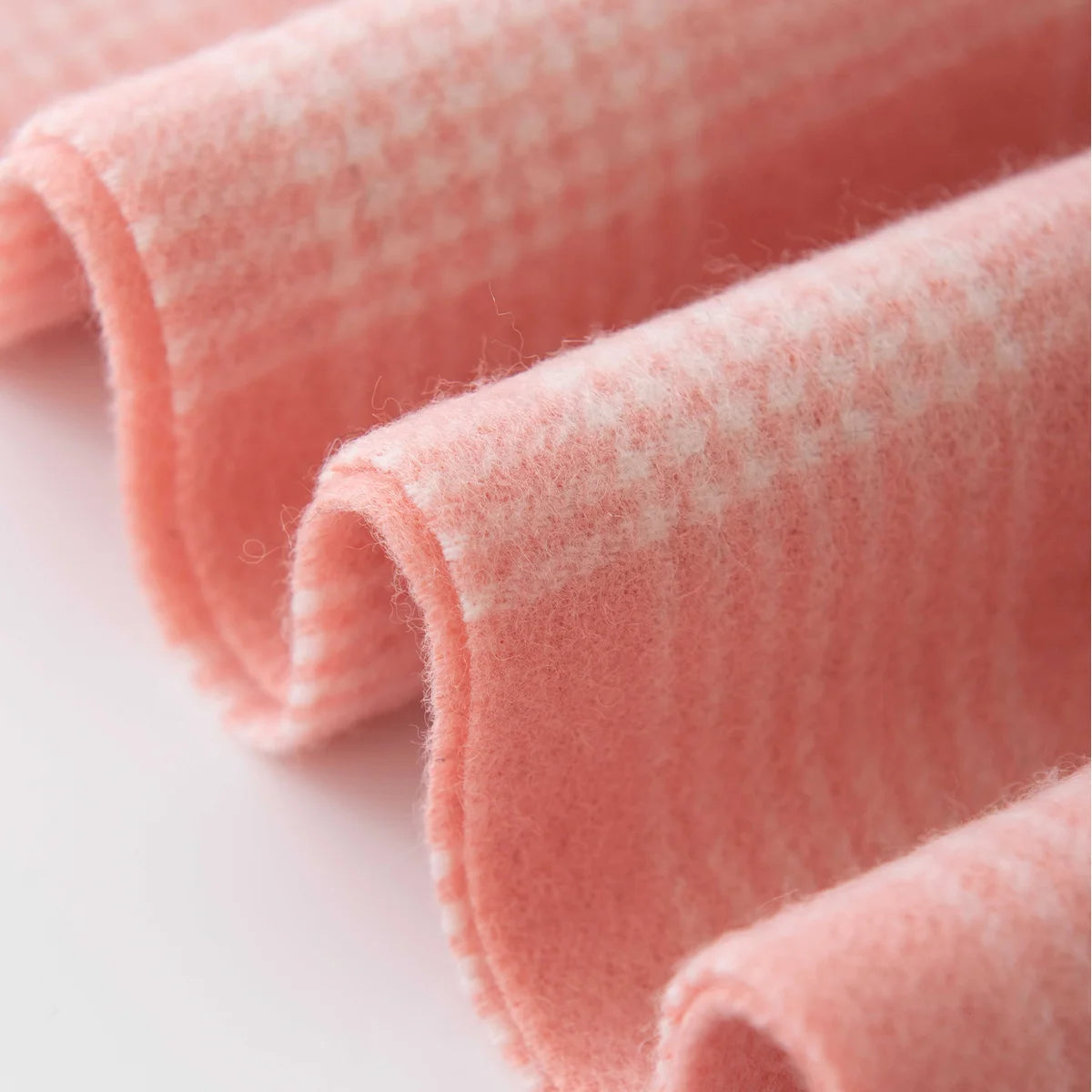 Folded pink plaid edge with rows of tiny checks