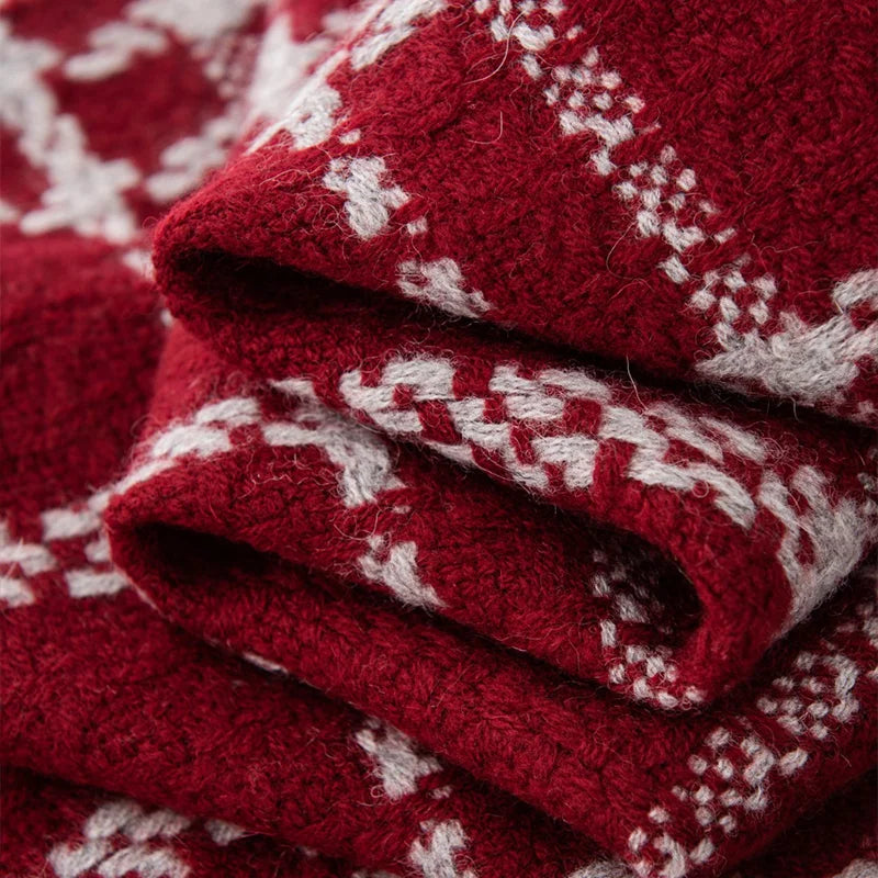 Folded red fabric revealing raised cream woven check lines