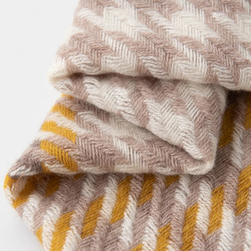 Folded taupe and mustard houndstooth with raised woven texture