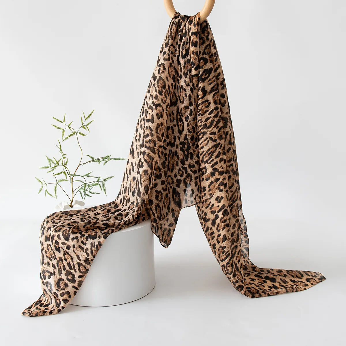 Golden brown leopard silk scarf hanging display