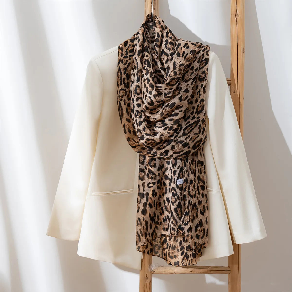 Golden brown leopard silk scarf on blouse