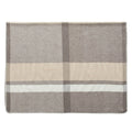Gray checked cashmere wrap displaying cream bands and stitching