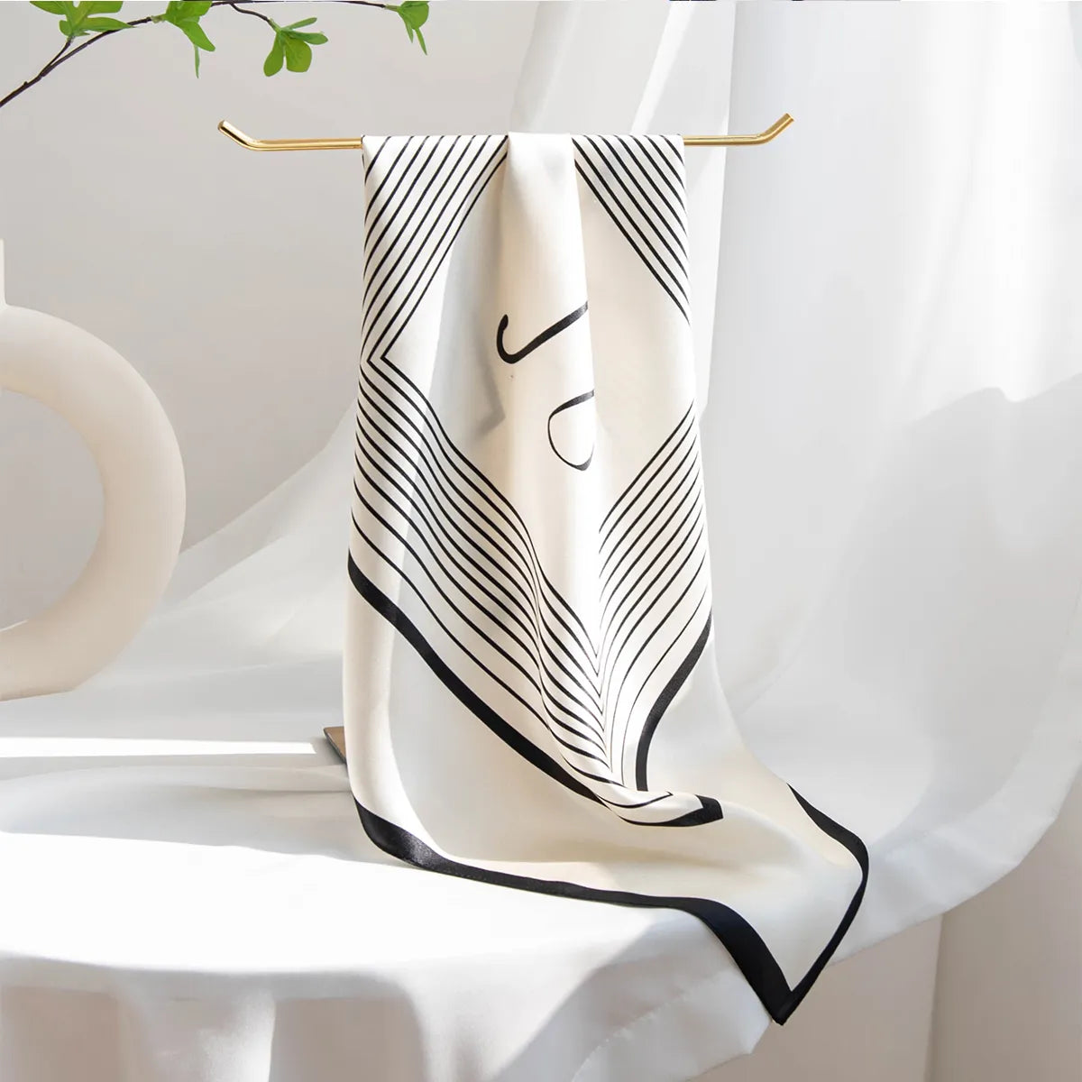Hanging cream silk scarf with V-shaped black line pattern