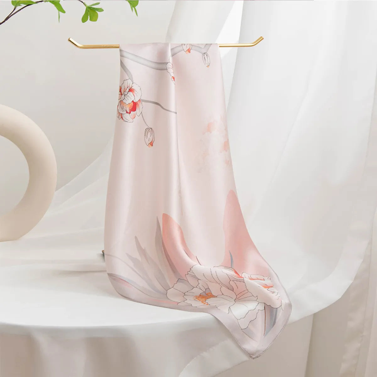Hanging light pink silk scarf with soft floral print