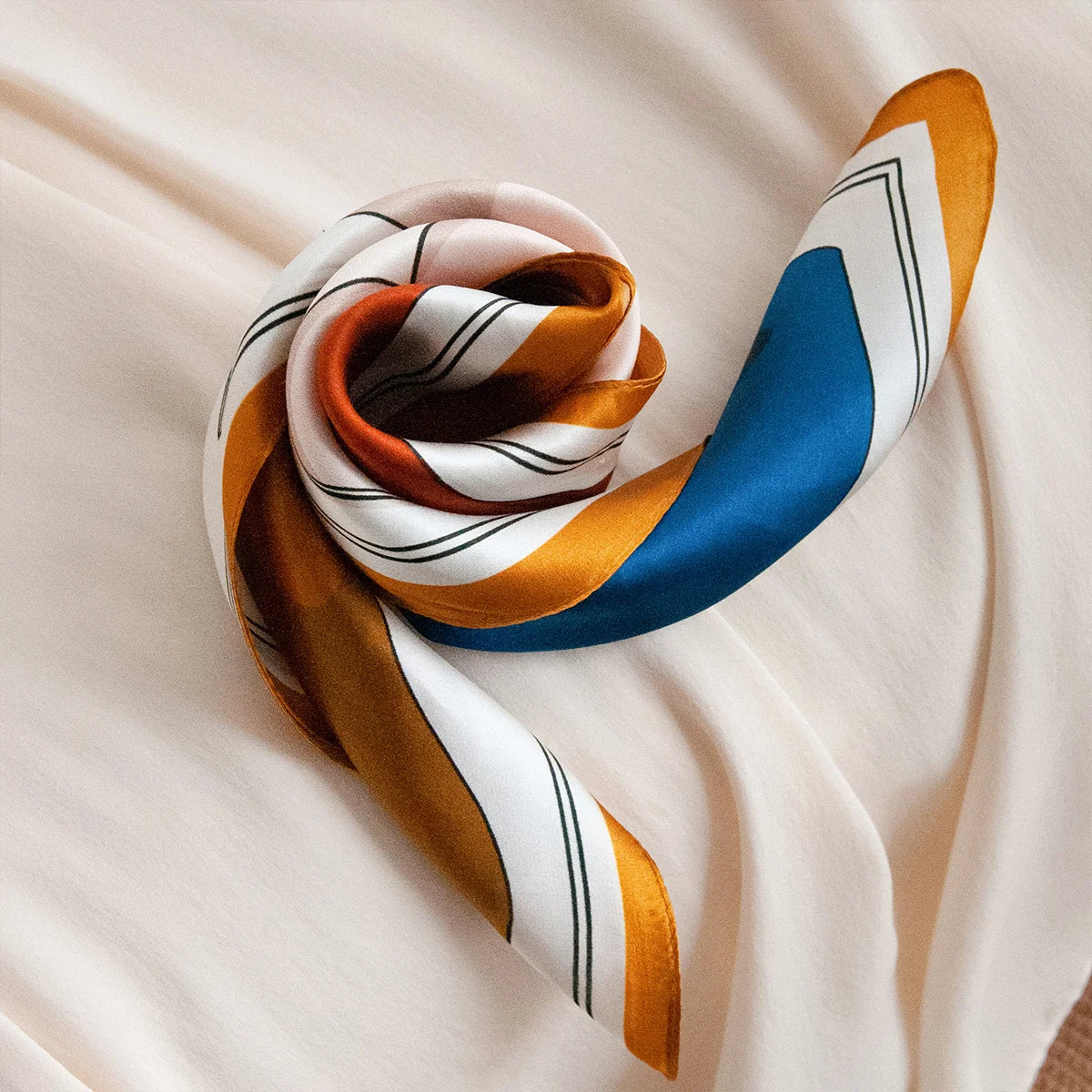 Knotted abstract Silk Square Scarf on satin background
