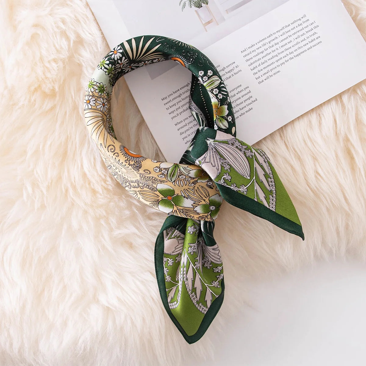 Knotted botanical silk scarf on book