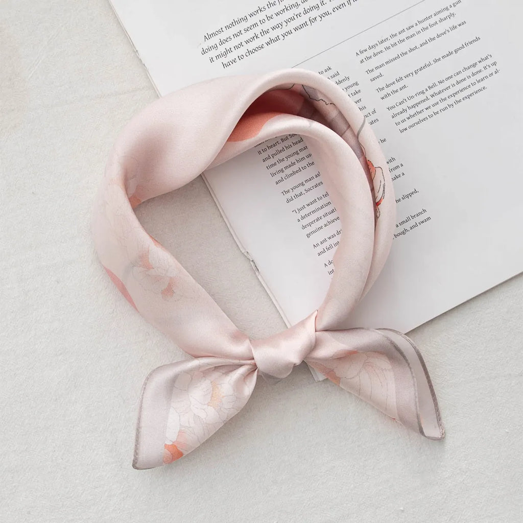 Knotted light pink silk scarf with white and peach flowers