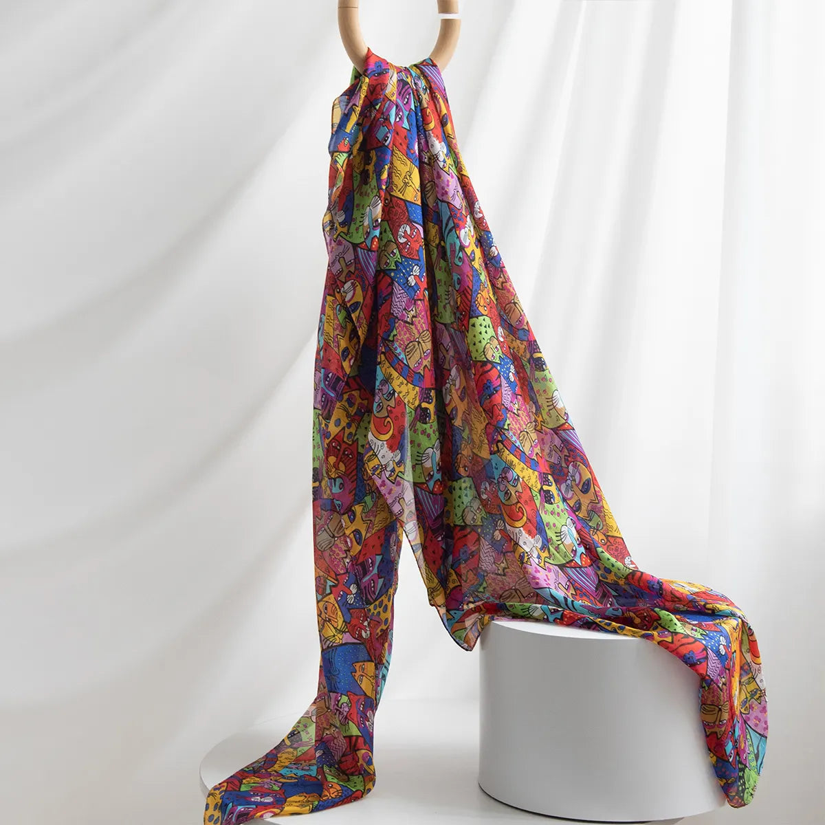 Large cat print silk scarf hanging on display