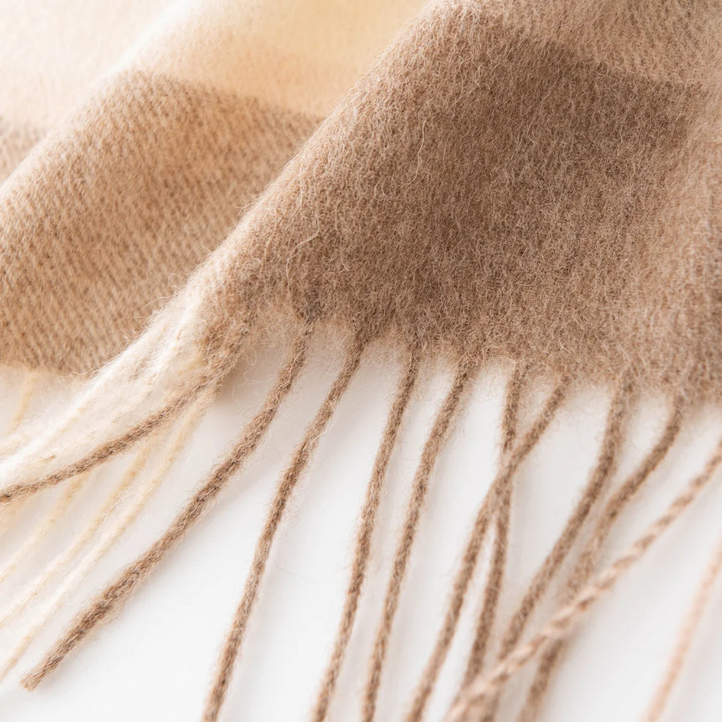 Long cream and camel fringe beneath softly brushed fabric